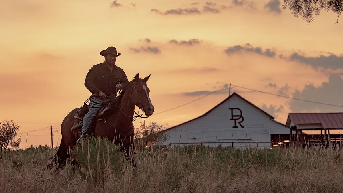 Cole Hauser as Rip Wheeler riding horseback at Dutton Ranch.