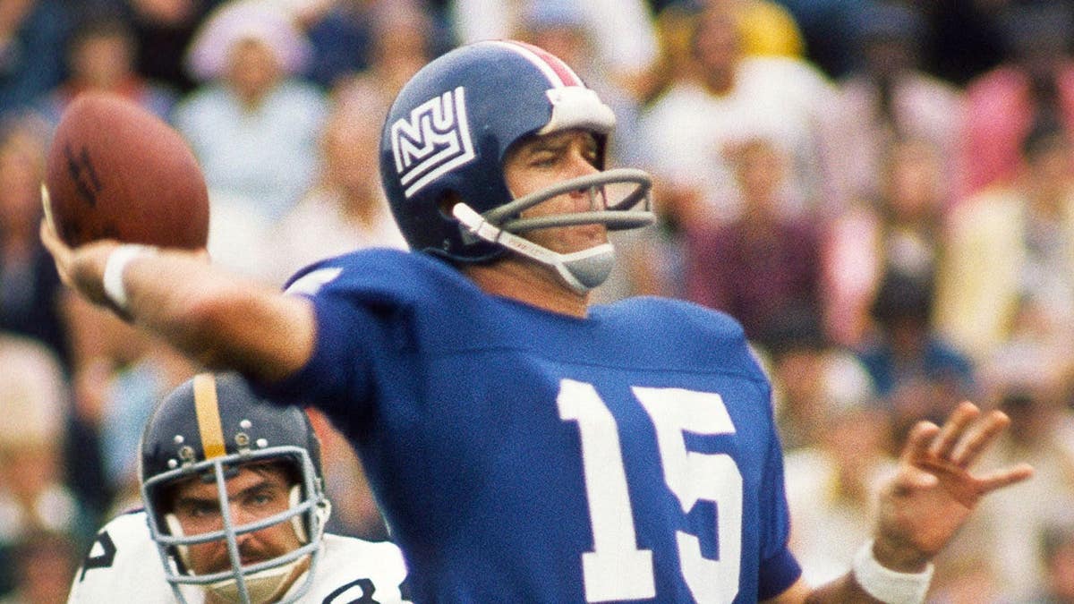 New York Giants backmost Craig Morton throwing a shot nether unit from Pittsburgh Steelers linebacker Andy Russell