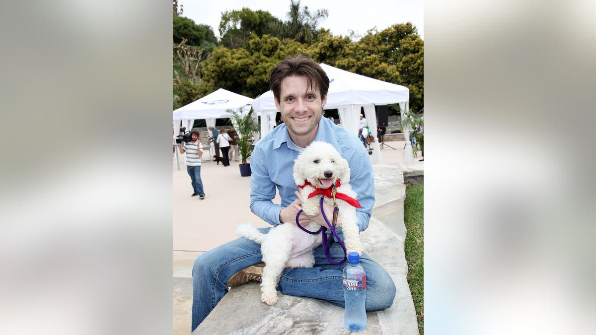Danny Pintauro and Cindy Crawford walking dogs at Church Estate Vineyards in Malibu