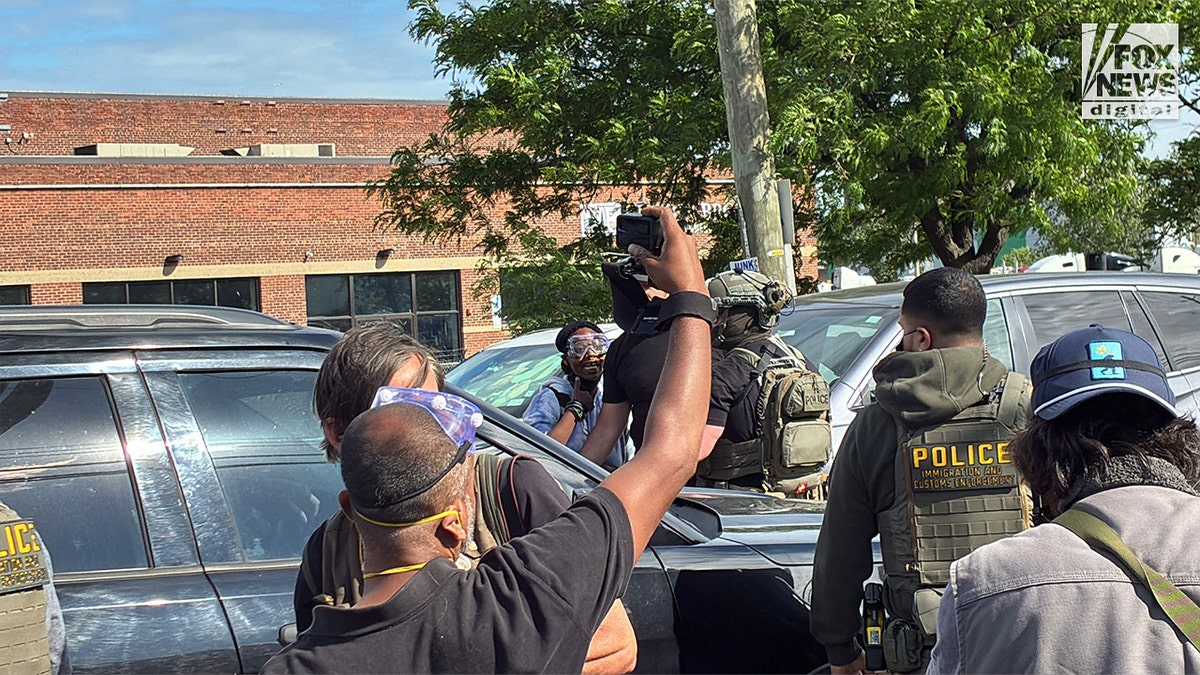 Crowd gathered outside Delaney Hall during a demonstration