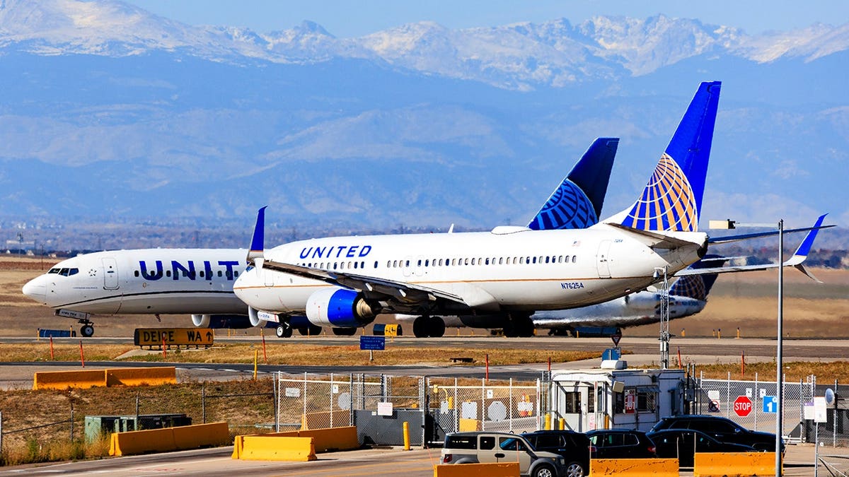 United Airlines airplanes taxi on runway at Denver International Airport