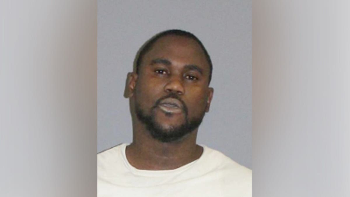 Dimario Wynter standing facing forward in a mugshot photo