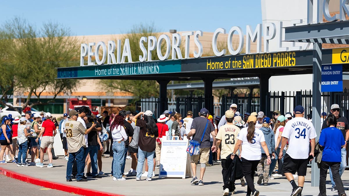 Fans arriving astatine  entranceway  gates of Peoria Sports Complex for Dodgers Padres outpouring  grooming  game