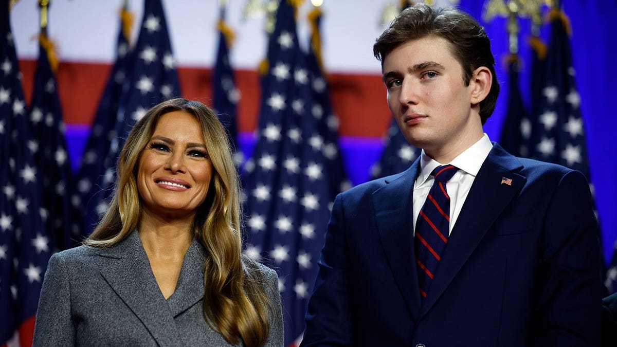 Former President Donald Trump speaking at election night event with Melania and Barron Trump in West Palm Beach