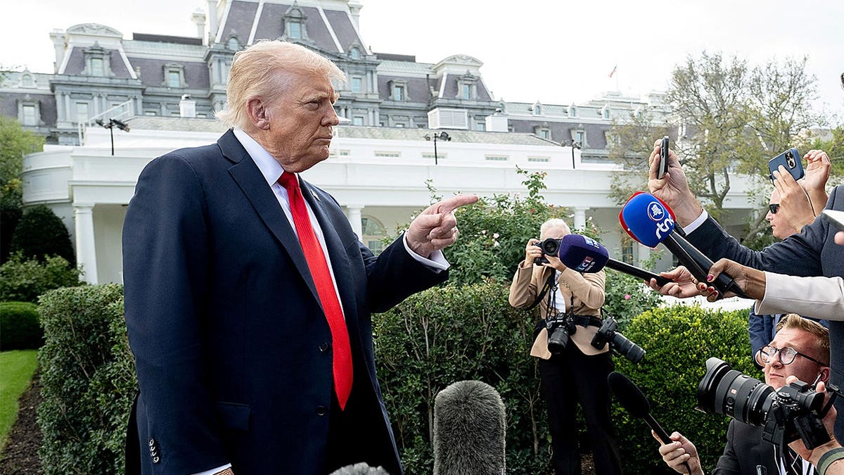 US President Donald Trump speaking to the press on the South Lawn of the White House