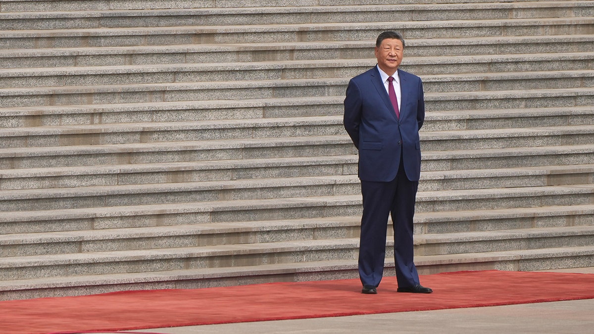 China's President Xi Jinping arrives to welcome President Donald Trump at the Great Hall of the People in Beijing