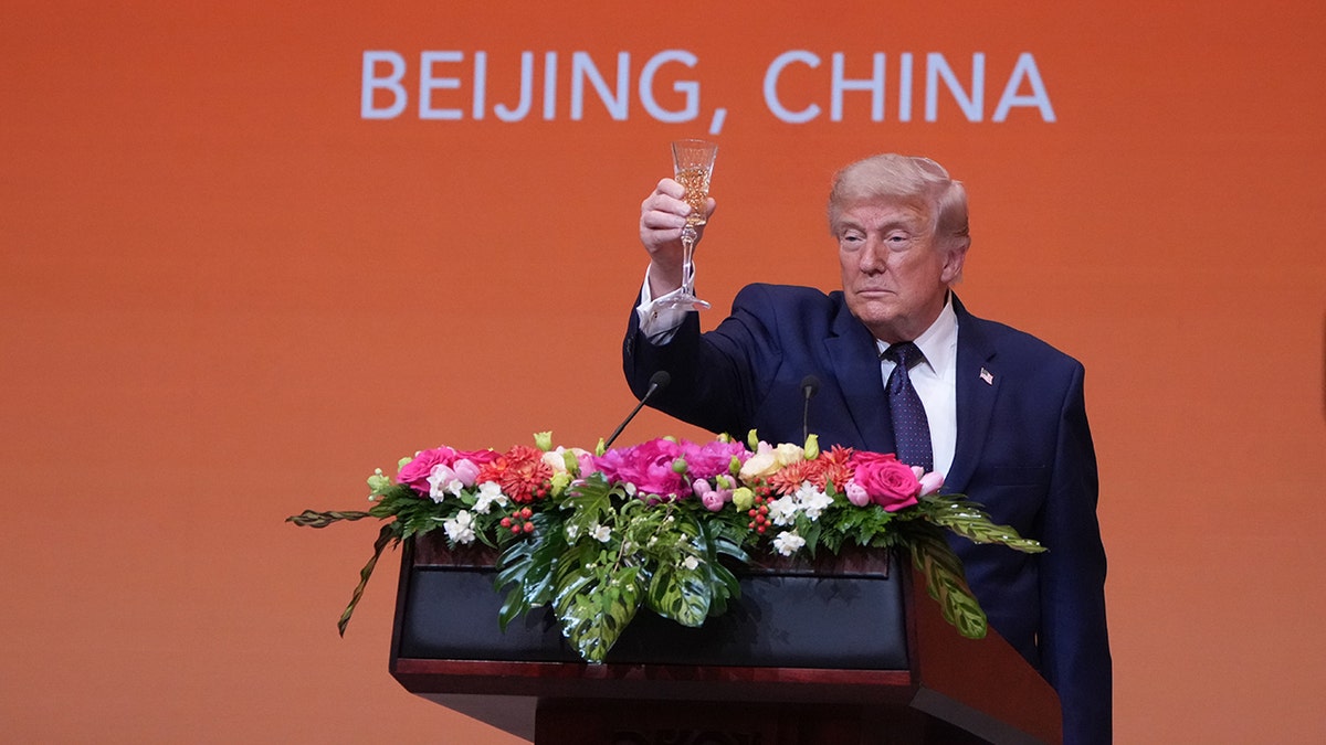 President Donald Trump proposing a toast with China's President Xi Jinping at the Great Hall of the People