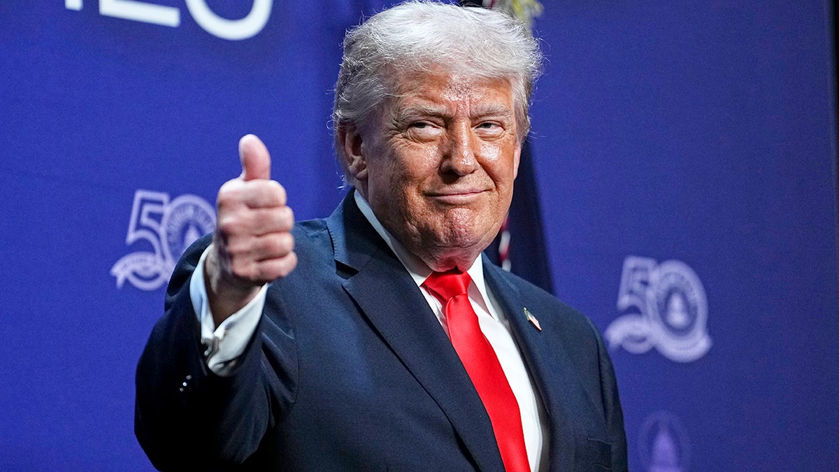 President Donald Trump gives thumbs up earlier speech