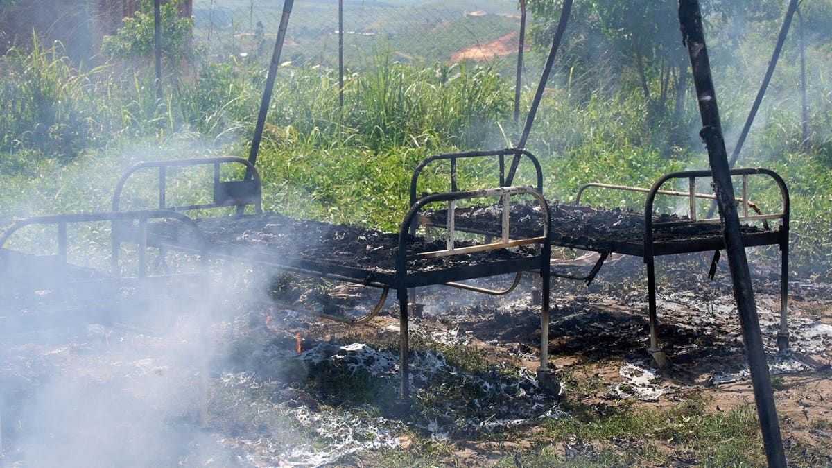 Charred infirmary  beds basal   successful  smoldering Ebola attraction    halfway  successful  Rwampara, Congo