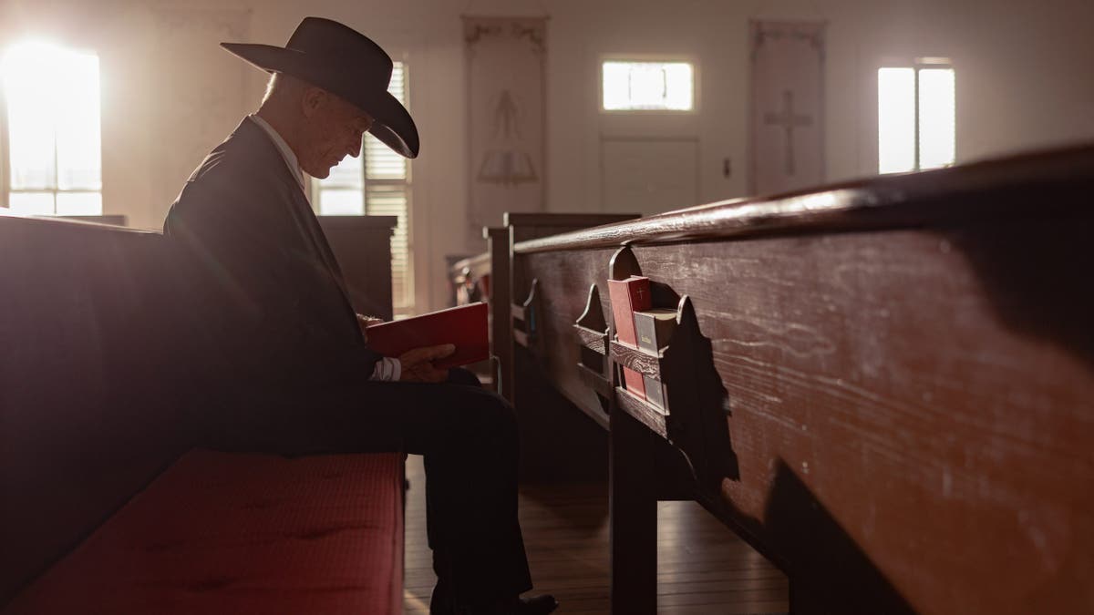 Ed Harris portraying Everett McKinney standing outdoors on Dutton Ranch.