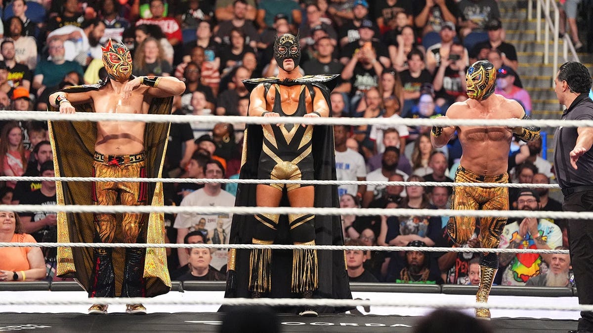 El Grande Americano entering the wrestling ring with Rayo Americano and Bravo Americano at Greensboro Coliseum Complex