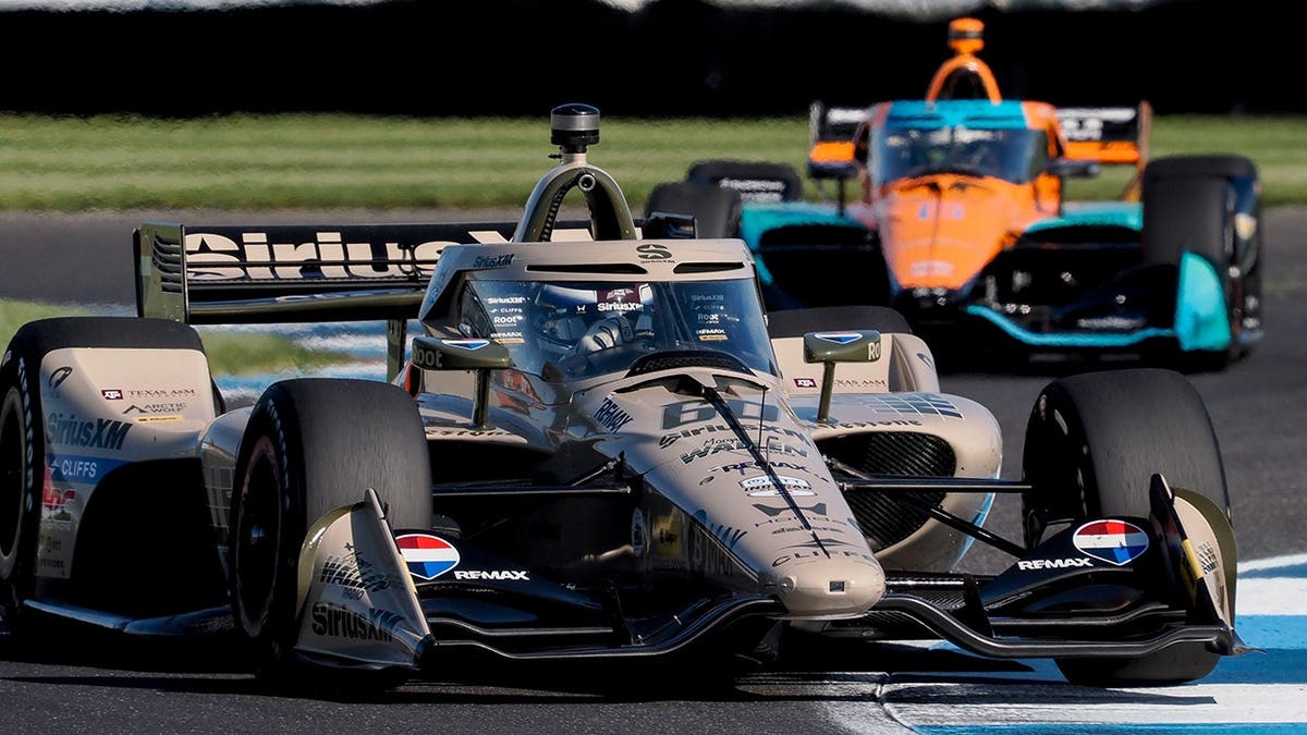 Felix Rosenqvist driving car   fig   60 done  a crook   astatine  Indianapolis Motor Speedway.