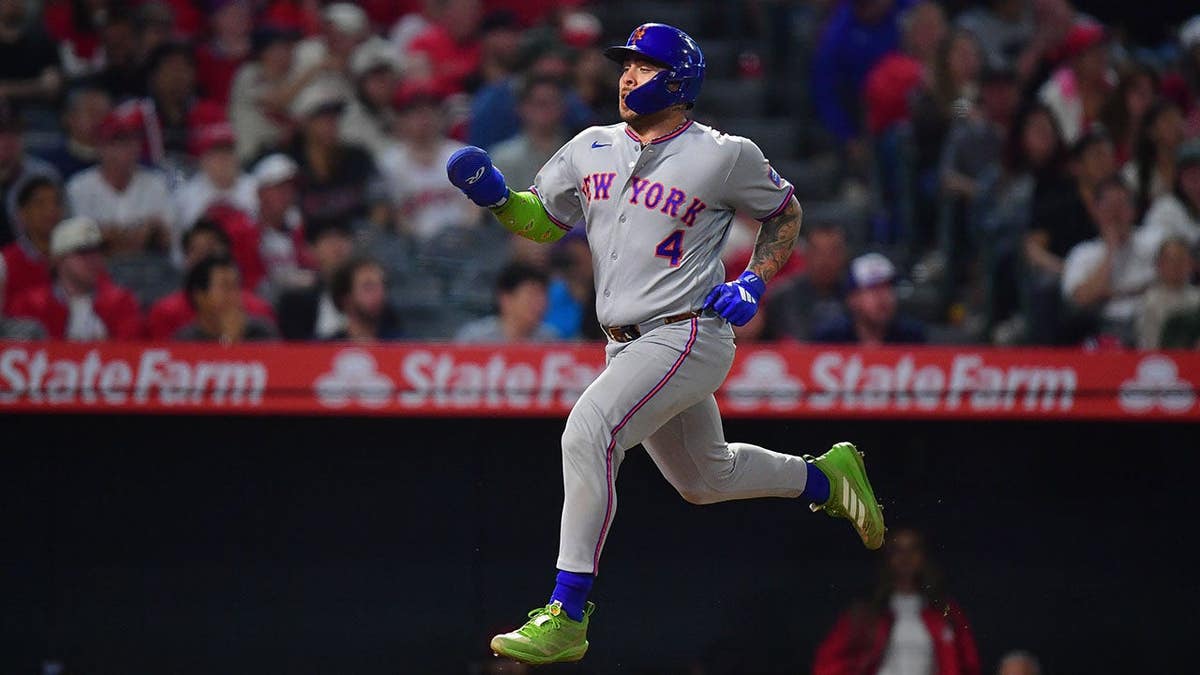 New York Mets catcher Francisco Alvarez running home to score at Angel Stadium