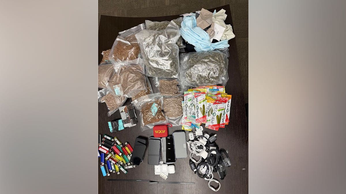 Deputies inspecting bags of marijuana and contraband at Washington State Prison in Davisboro Georgia