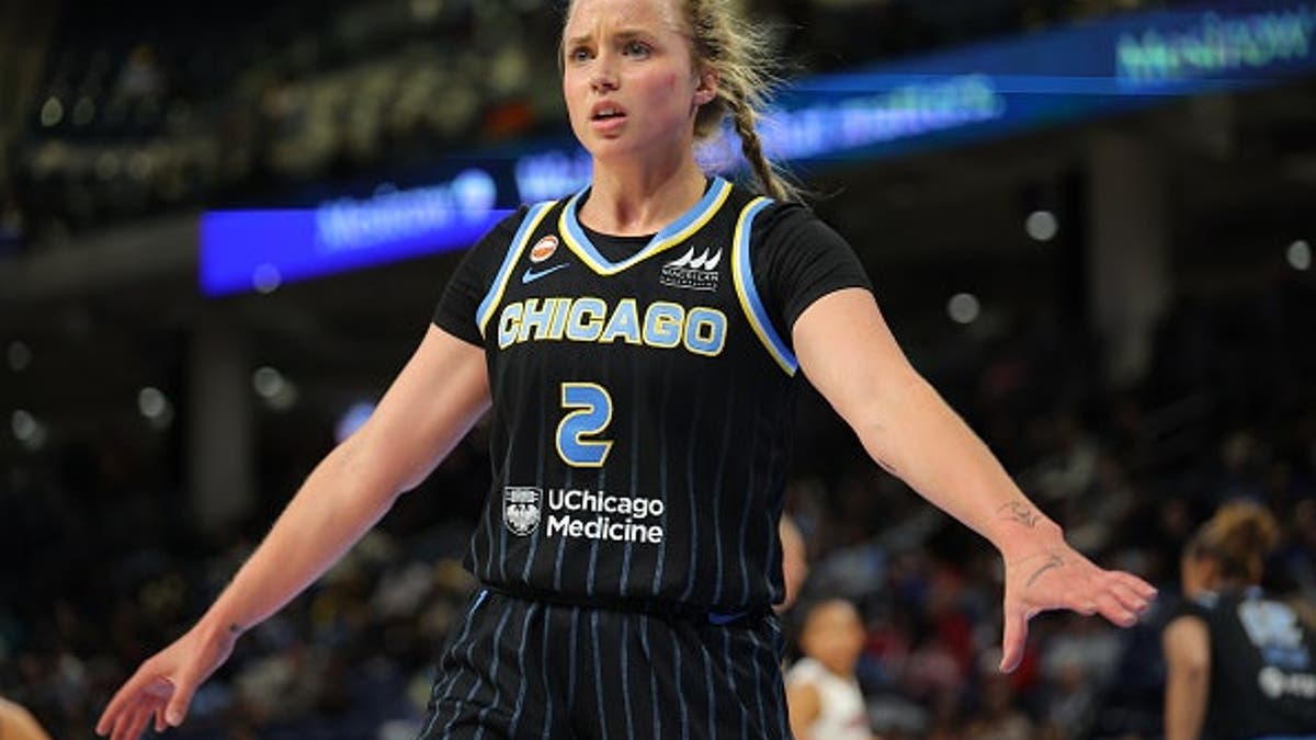 Hailey Van Lith wearing Chicago Sky uniform looking on during basketball game at Wintrust Arena