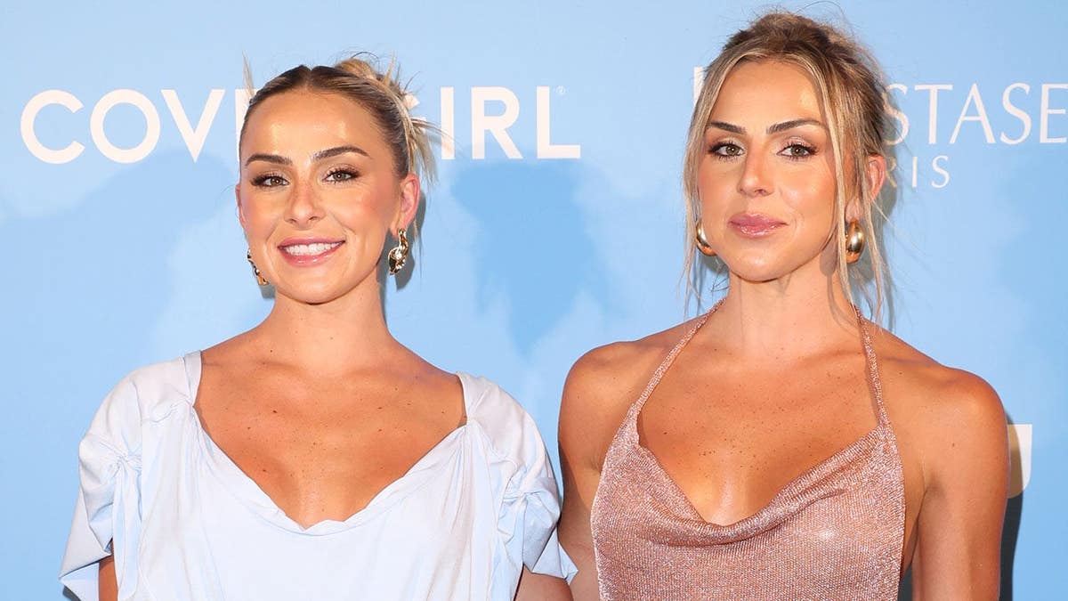 Haley Cavinder and Hanna Cavinder posing at Sports Illustrated Swimsuit Dinner in Miami Beach