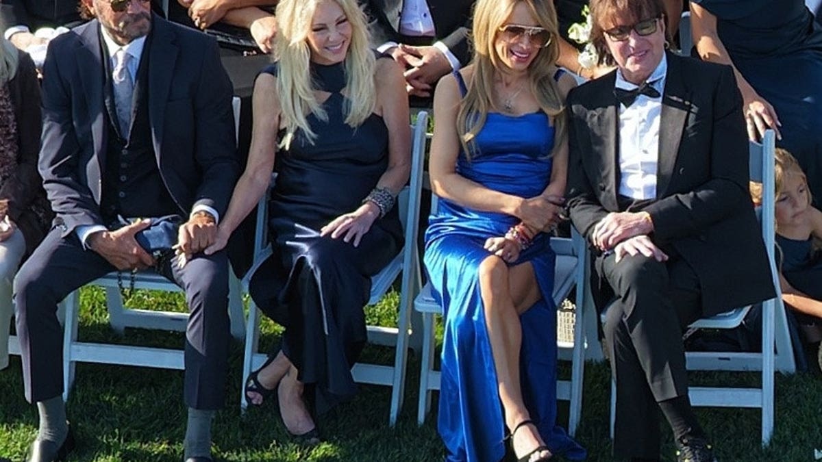 Heather Locklear and Richie Sambora walking with their daughter Ava Locklear at her wedding in Montecito California