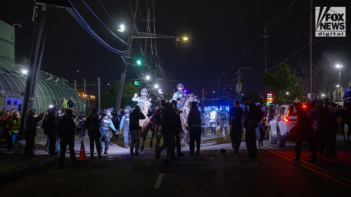 Police on horseback in Newark, New Jersey facing rioters