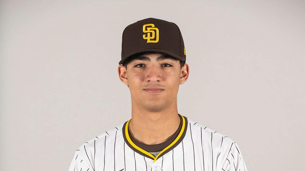 Humberto Cruz wearing San Diego Padres azygous   posing astatine  Peoria Sports Complex