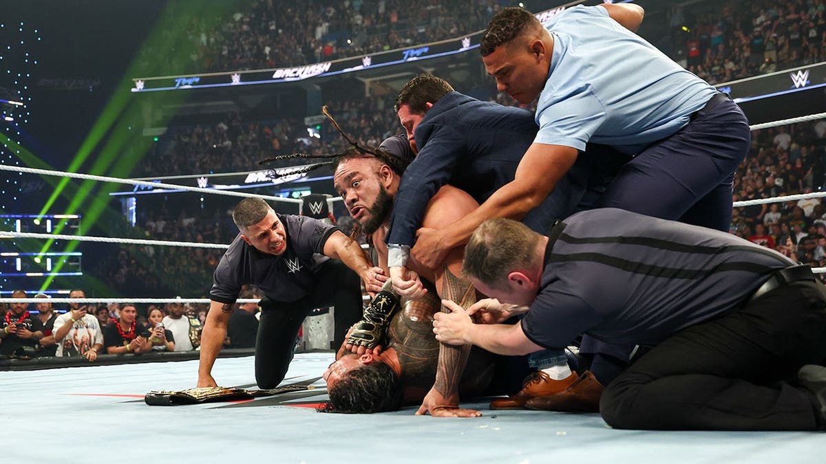 Jacob Fatu wrestling Roman Reigns in WWE Backlash match