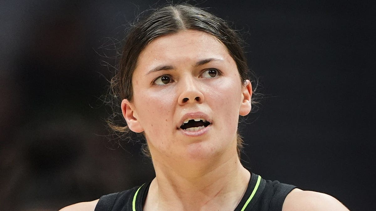 Seattle Storm defender  Jade Melbourne looking connected  aft  chipping a bony   during a hoops  game