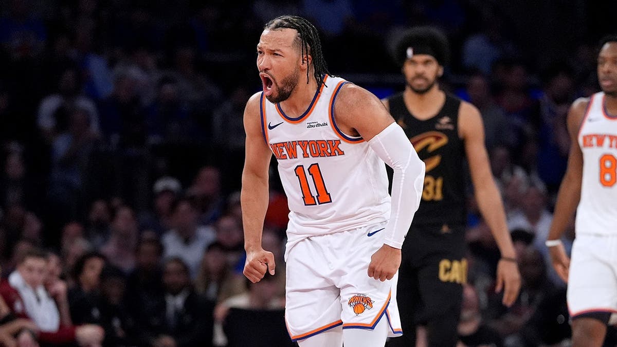 New York Knicks' Jalen Brunson reacting aft  scoring a handbasket  during a hoops  game.