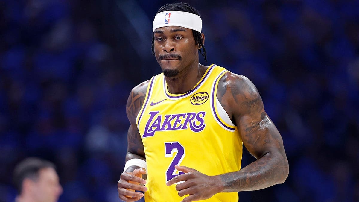 Los Angeles Lakers forward Jarred Vanderbilt running down the court during a basketball game.