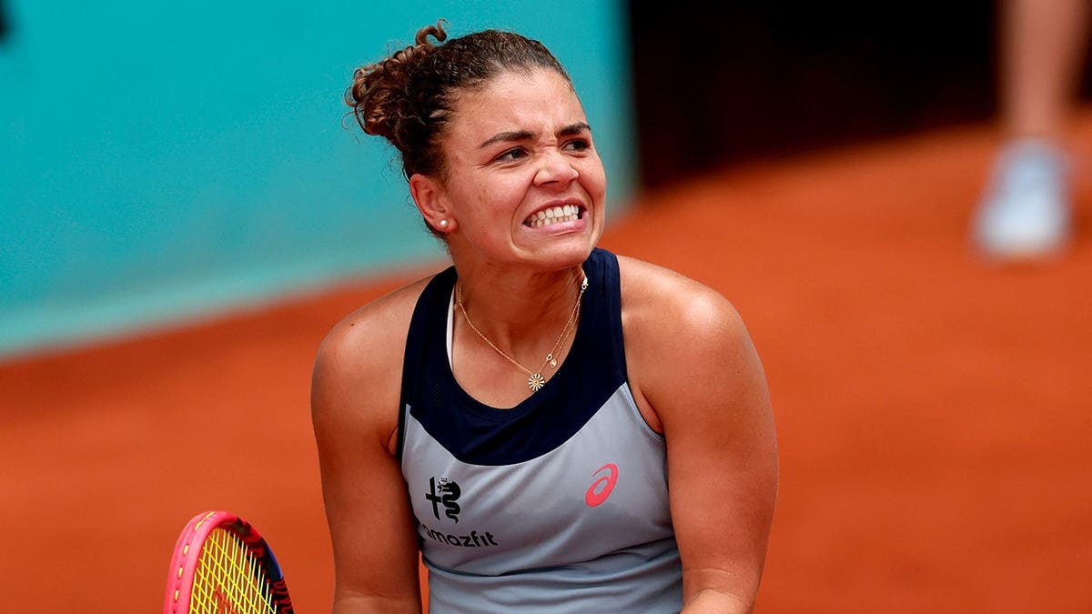 Jasmine Paolini hits a tennis shot against Hailey Baptiste at the Madrid Open