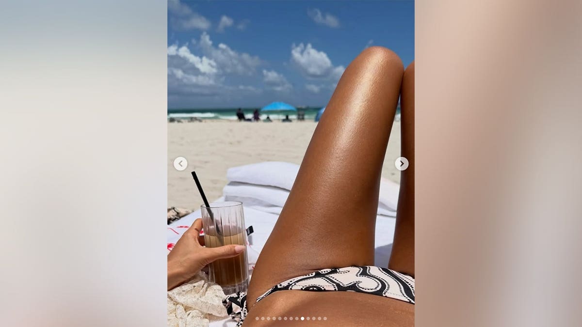 Jessica Alba lounging on the beach in a bikini.