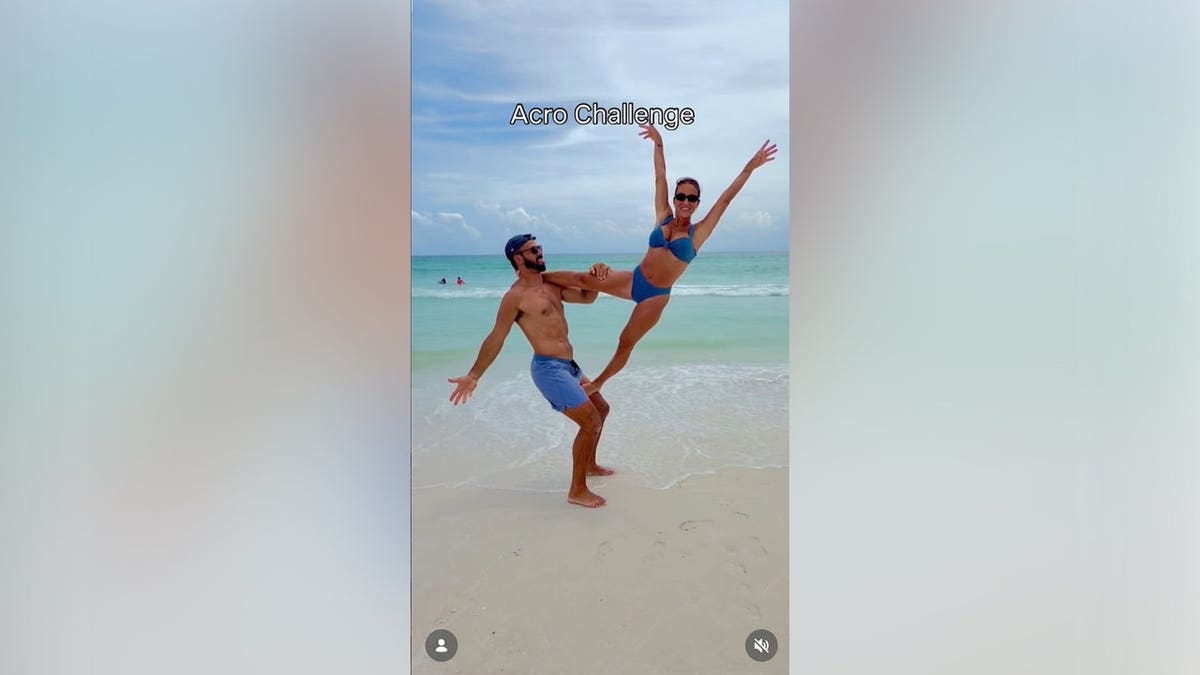 Jesse James Decker and her husband performing acrobatics on the beach.