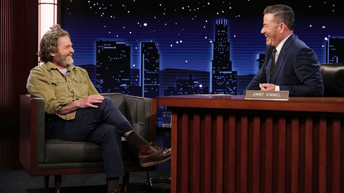 Zach Galifianakis and Jimmy Kimmel seated on the Jimmy Kimmel Live! set