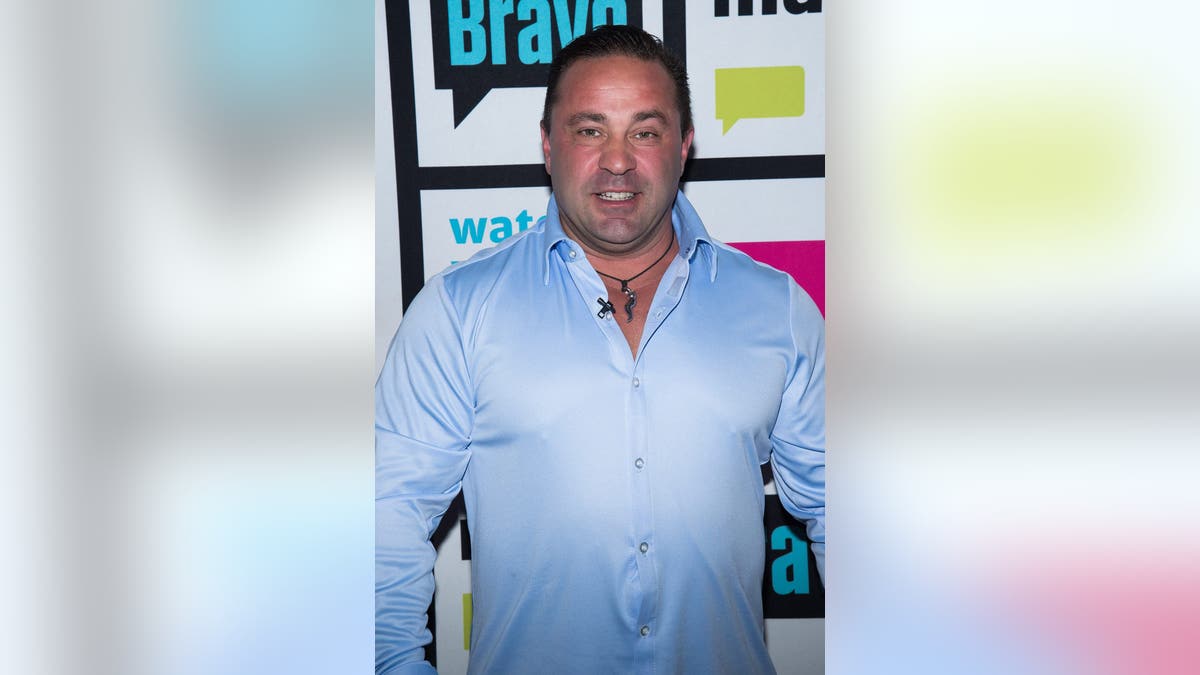 Joe Giudice standing in a studio setting