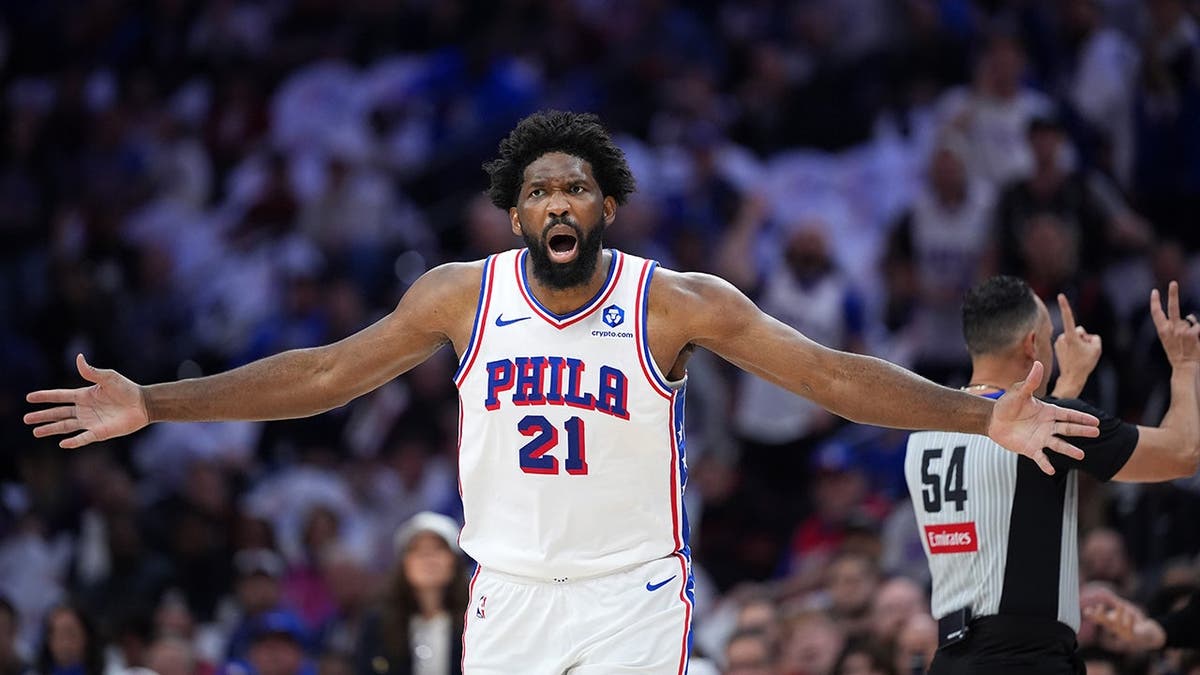 Philadelphia 76ers' Joel Embiid reacting aft  a foul telephone  during NBA playoff game