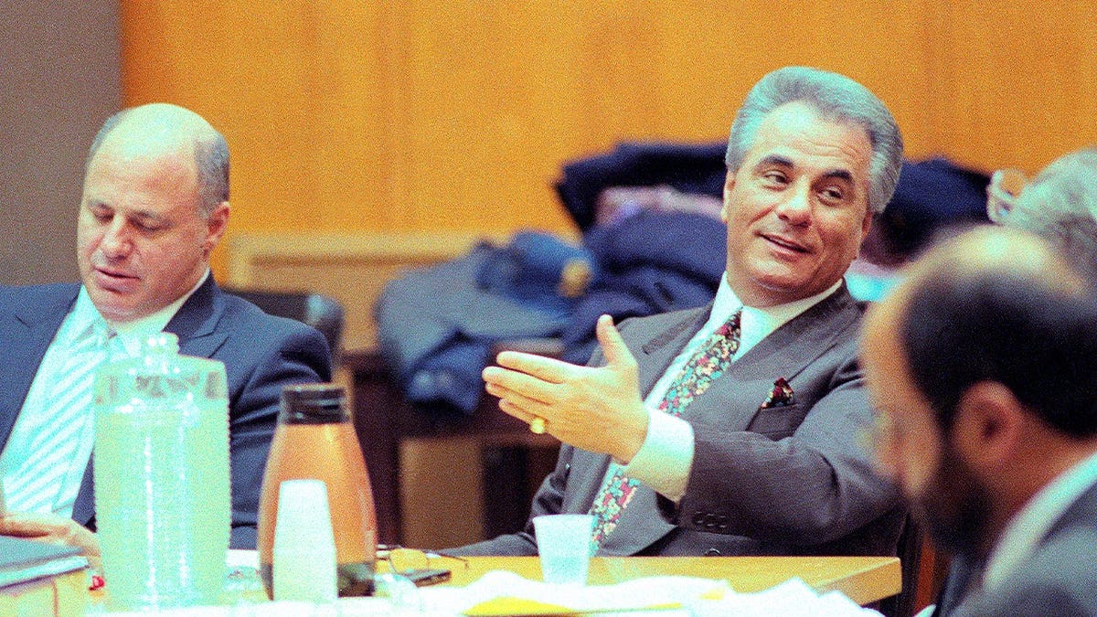John Gotti seated with his lawyers in court