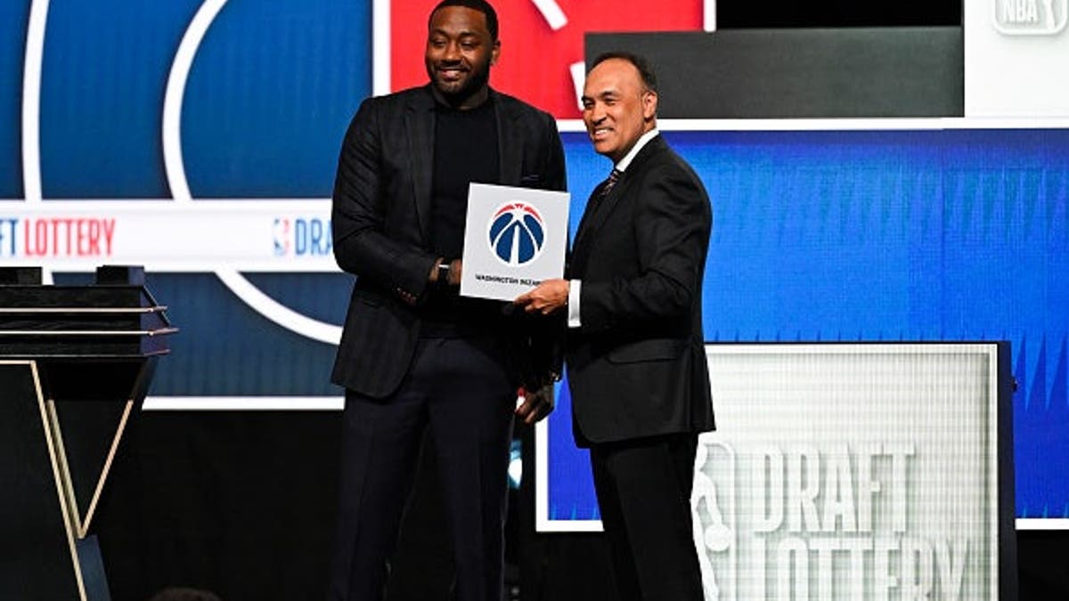 John Wall and Mark Tatum posing together at the NBA Draft Lottery event in Chicago