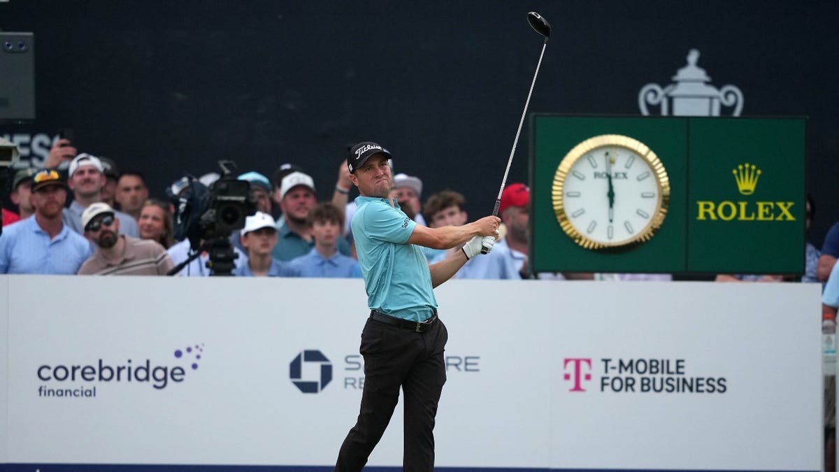 Justin Thomas playing golf on the 18th green during the PGA Championship.
