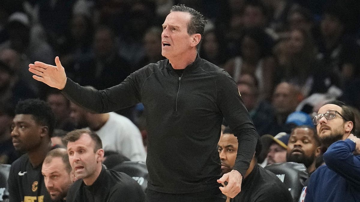 Cleveland Cavaliers head coach Kenny Atkinson yelling from the sideline during a basketball game