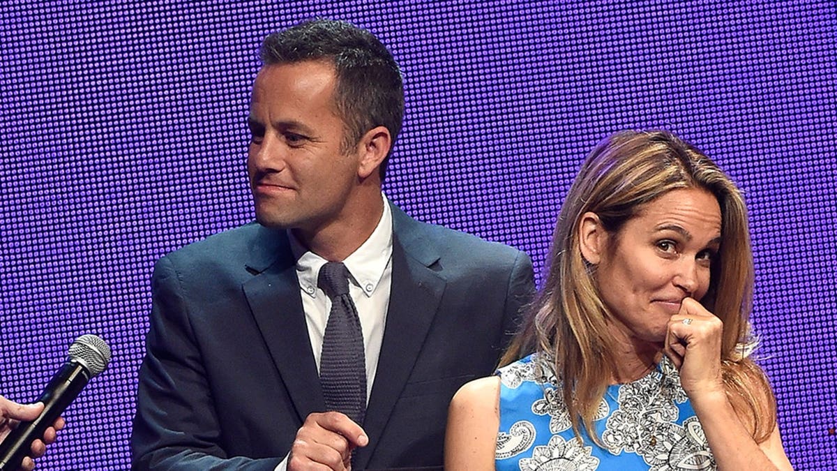 Host Kirk Cameron and wife Chelsea Noble speaking onstage at the Grand Ole Opry House