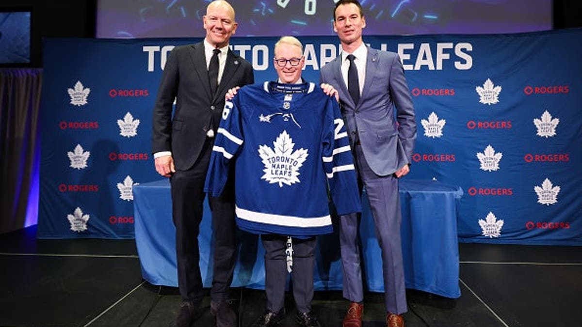Mats Sundin, Keith Pelley, and John Chayka posing at a press conference in Toronto