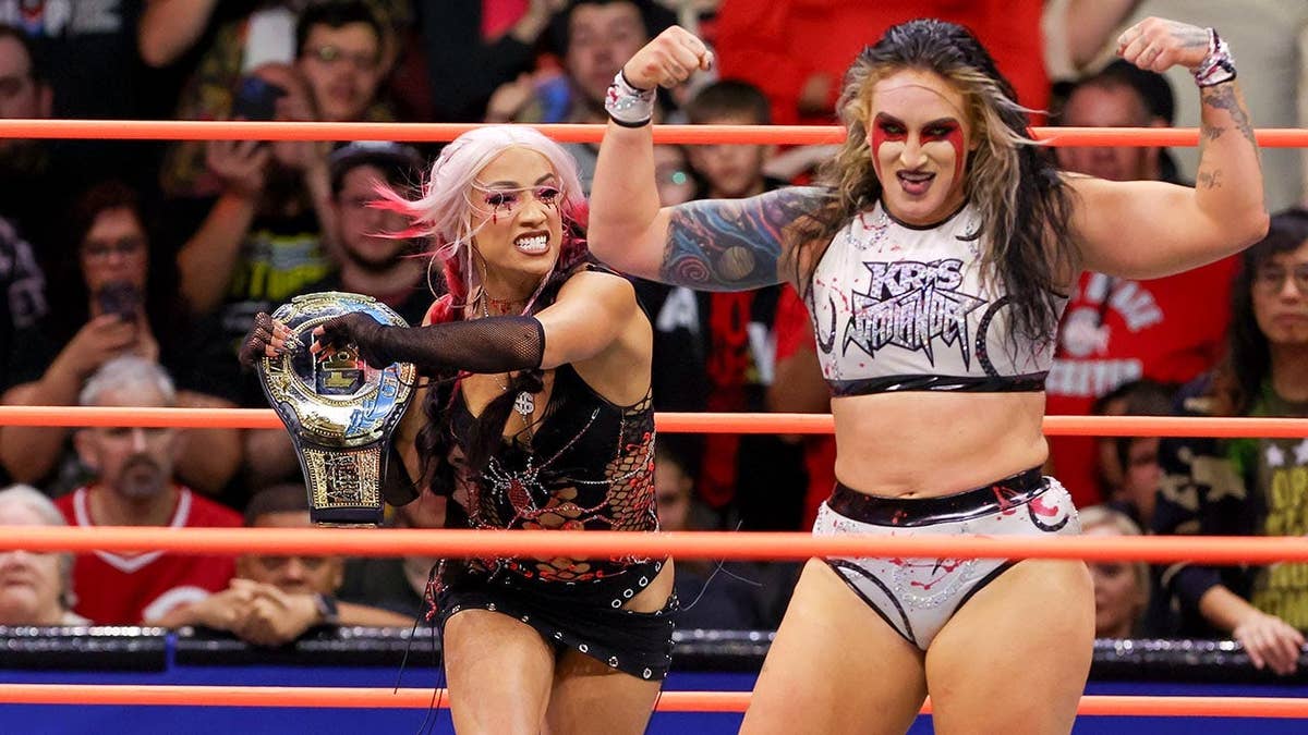 Mercedes Mone attacking Kris Statlander with title loop successful wrestling ring