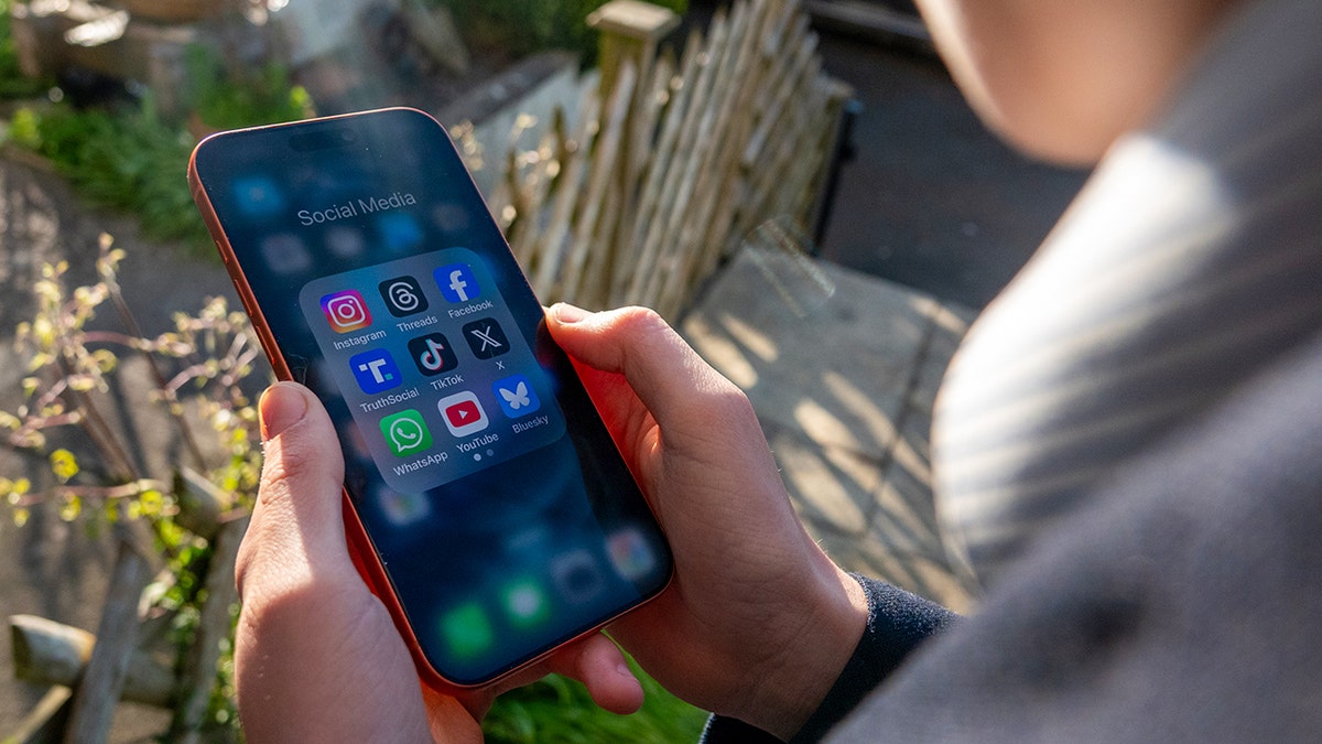 Person looking for apps on their smartphone.