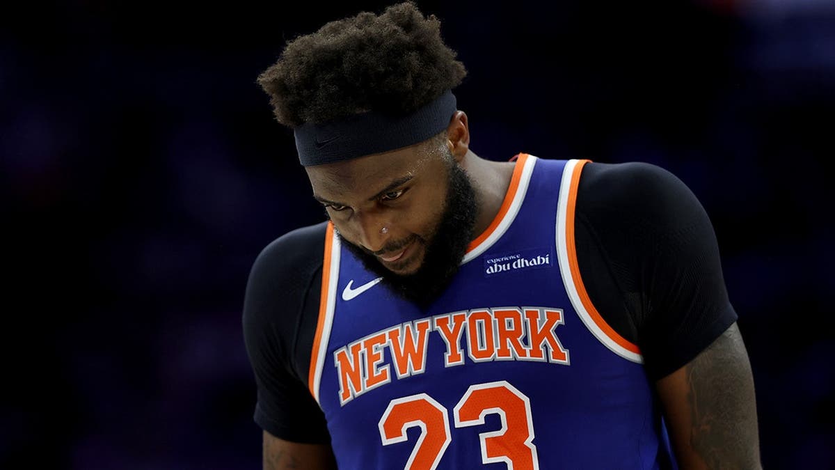 Mitchell Robinson of the New York Knicks looking on during a basketball game