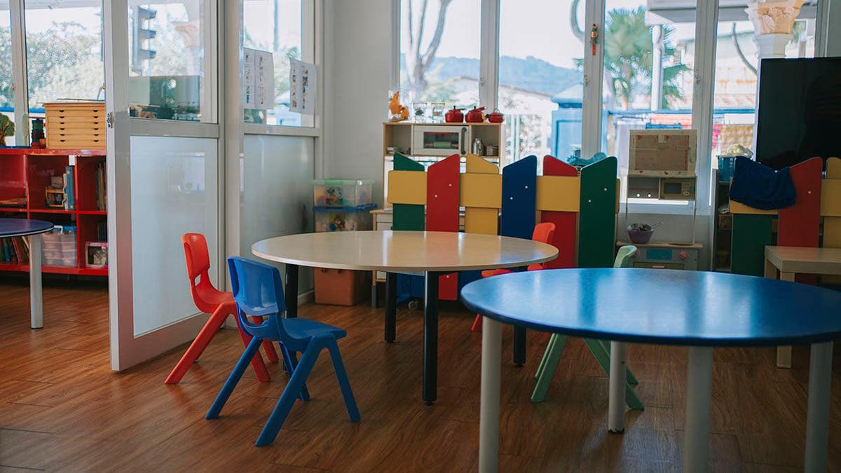 Montessori preschool classroom with child-sized tables and educational materials