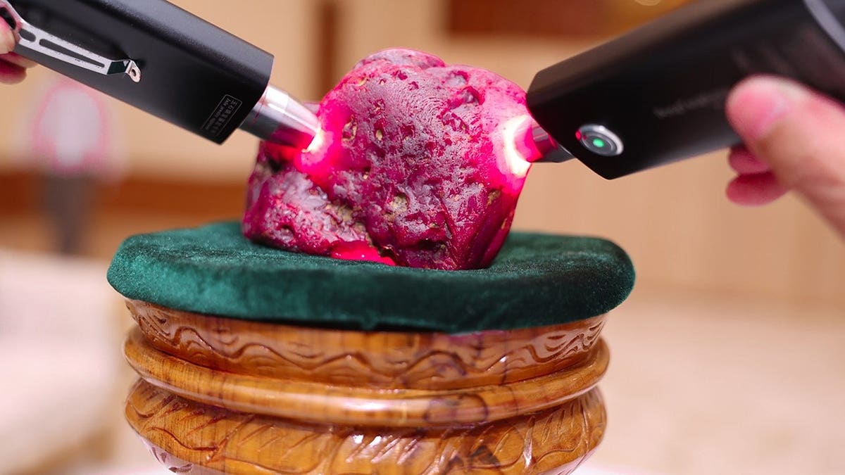 Myanmar officials inspecting a newly discovered ruby at the president office in Naypyitaw
