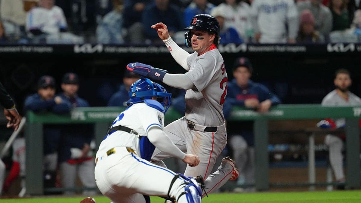 Nick Sogard tagged out at home plate by Carter Jensen at Kauffman Stadium