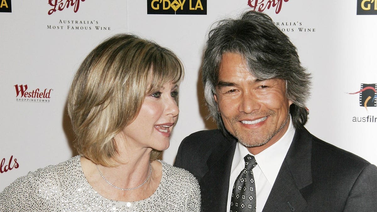 Olivia Newton-John and Patrick McDermott arriving at a gala event in Los Angeles