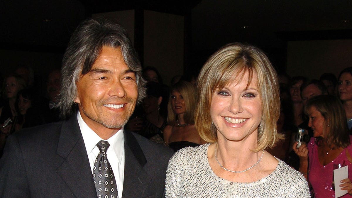 Olivia Newton John and boyfriend Patrick McDermott posing together