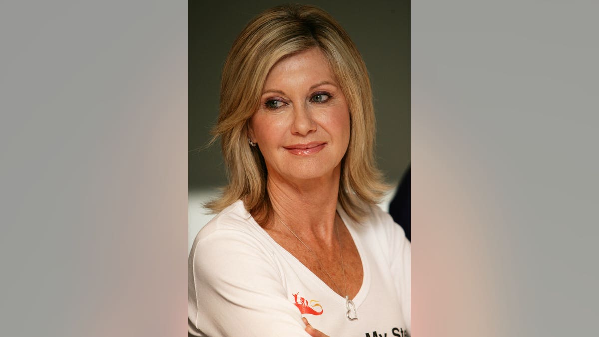 Olivia Newton-John announcing team for walking trek at Hilton Hotel in Sydney