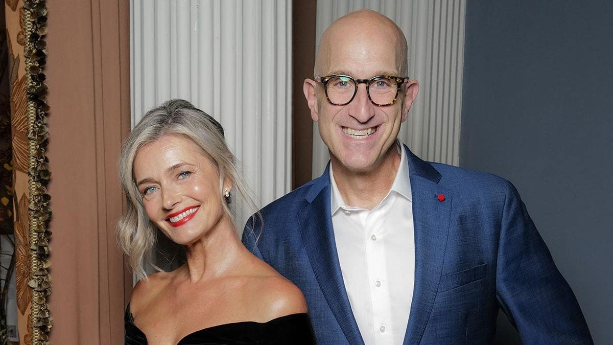 Paulina Porizkova and Jeff Greenstein standing together at an event in London