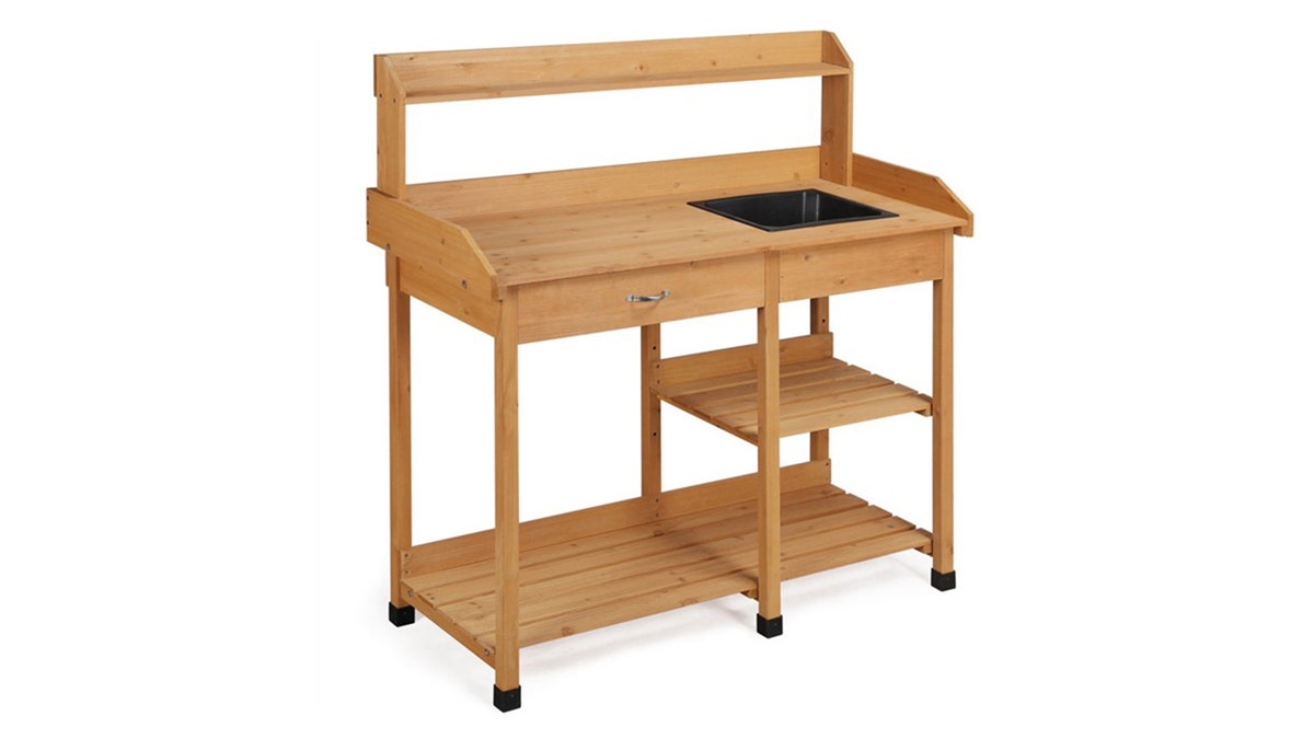 A raised, wheelable bench makes potting simpler.
